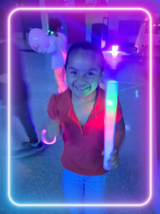 a girl smiling with LED lights